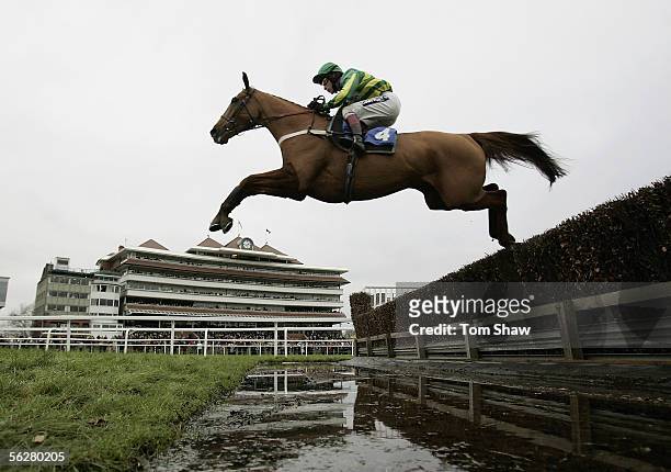 Copsale Lad ridden by Mick Fitzgerald jumps the water jump on his way to winning the Dubai Duty Free Fulke Walwyn Novices Steeple Chase during the...