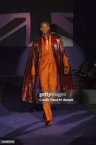 Models walk the runway at the "Fashion In Motion: Ozwald Boateng" catwalk show and 20th anniversary party at Victoria & Albert Museum on November 25,...