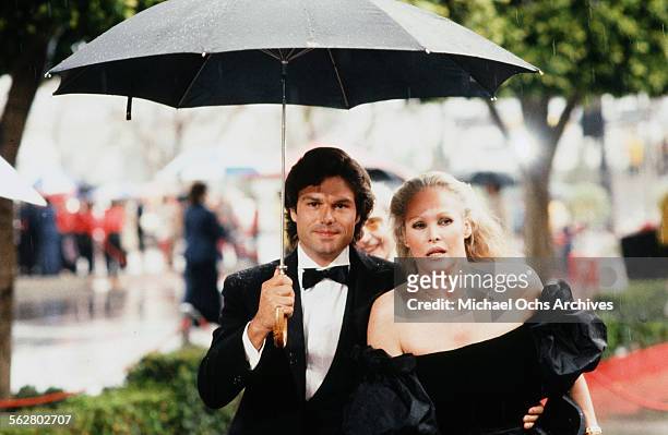Actress Ursula Andress with actor Harry Hamlin arrive to the 54th Academy Awards at Dorothy Chandler Pavilion in Los Angeles,California.