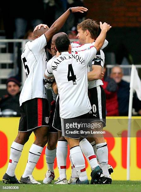 Brian McBride of Fulham is congratulated by his teammates on scoring the opening goal for Fulham during the Barclays Premiership match between Fulham...