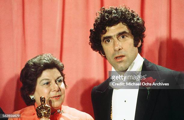 Actor Elliott Gould poses backstage with Verna Fields winner of " Best Film Editing" award during the 48th Academy Awards at Dorothy Chandler...