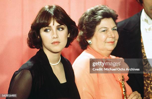 Actress Isabelle Adjani poses backstage with Verna Fields winner of " Best Film Editing" award during the 48th Academy Awards at Dorothy Chandler...