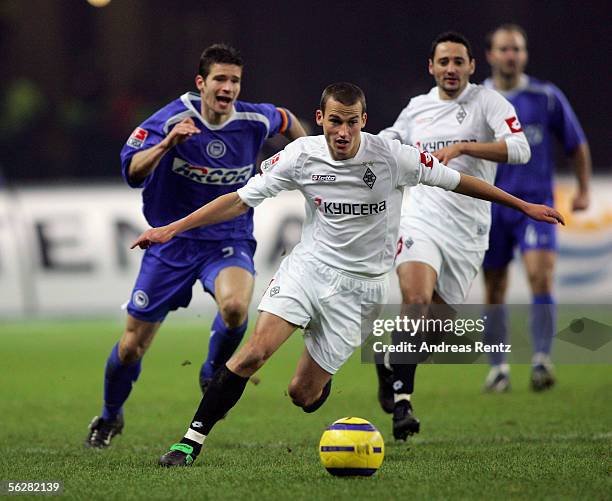 Peer Kluge of Monchengladbach vies for the ball with Arne Friedrich of Berlin and Oliver Neuville of Monchengladbach during the Bundesliga match...