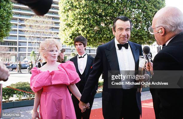Walter Matthau with wife Carol Grace and son Charlie arrives at the 55th Academy Awards at Dorothy Chandler Pavilion in Los Angeles,California.
