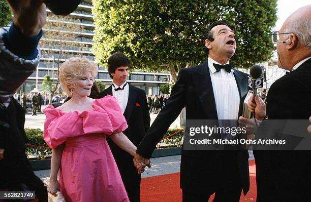 Walter Matthau with wife Carol Grace and son Charlie arrives at the 55th Academy Awards at Dorothy Chandler Pavilion in Los Angeles,California.