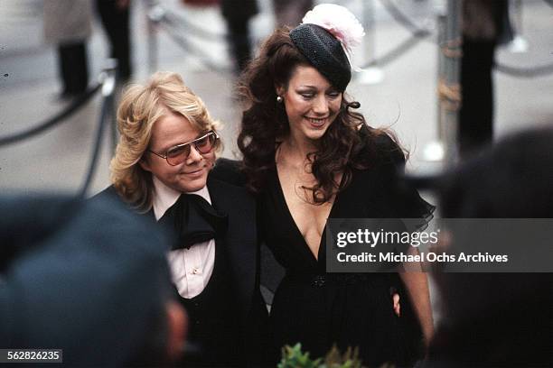 Composer Paul Williams arrives with actress Marisa Berenson to the 47th Academy Awards at Dorothy Chandler Pavilion in Los Angeles,California.