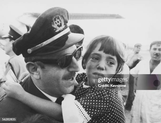 Flight engineer Yona Lichtman is reunited with his daughter at Lod Airport in Israel, after his El Al aircraft was hijacked by members of the Popular...