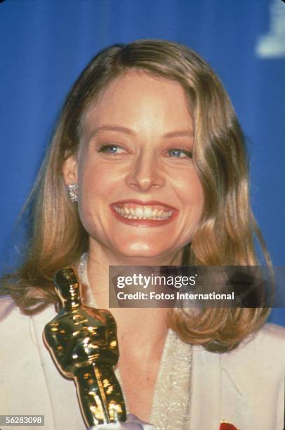 American actress Jodie Foster poses backstage with her 'Oscar' award for Best Actress in a Leading Role for her performance in the film 'The Silence...