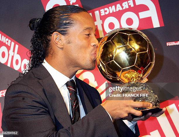 Brazilian Barcelona midfielder Ronaldinho poses with his trophy after being awarded as 50th Ballon d'Or , for best football player of the year, 28...