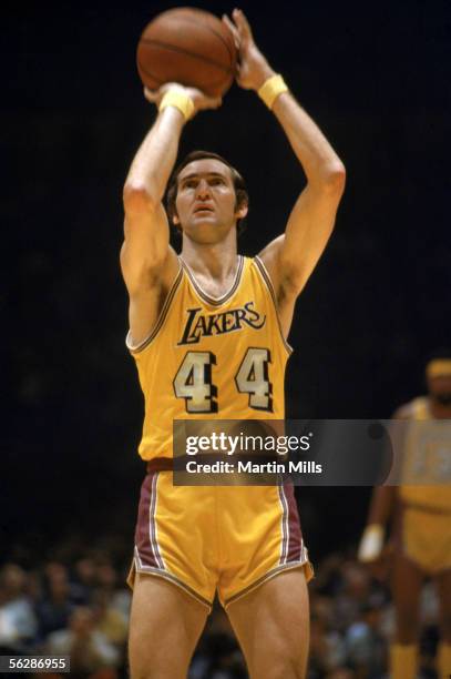 Jerry West of the Los Angeles Lakers shoots a free throw during a 1971 NBA game against the New York Knicks at the Great Western Forum in Inglewood,...