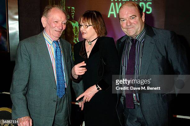 Brian Friel, Mrs. Mortimer and Paul McGuinness attend the Evening Standard Theatre Awards, the annual theatrical awards hosted by the London...