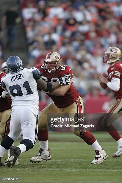 Offensive guard Adam Snyder of the San Francisco 49ers blocks defensive tackle Chuck Darby of the Seattle Seahawks during the NFL game at Monster...