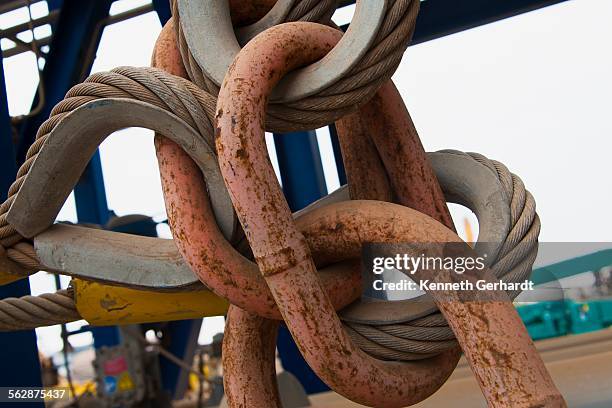 heavy duty rusted chain and cable, angola, luanda bay - luanda bay stock pictures, royalty-free photos & images