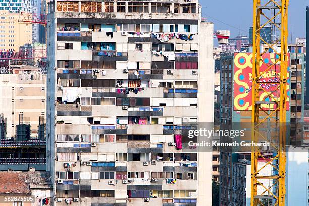 rundown block of flats, angola, luanda bay - luanda bay stock pictures, royalty-free photos & images