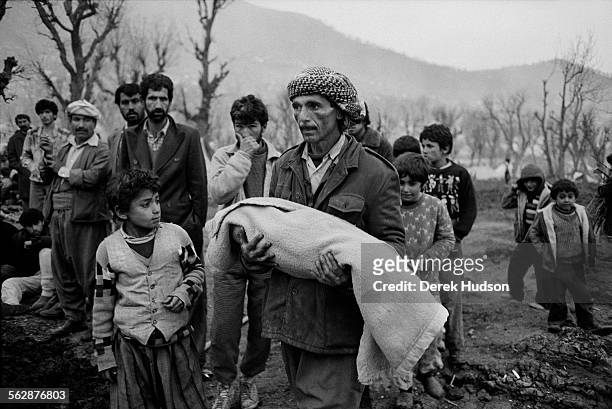 Burial of his youngest child who fell sick during the exodus across the Zagros mountain range whilst fleeing persecution by Saddam Hussein's...