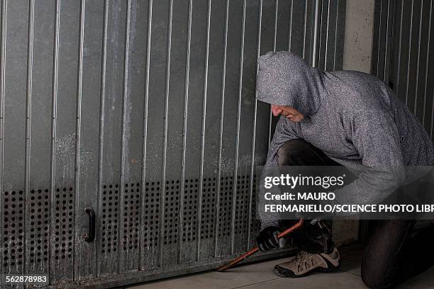 man breaking into building - burglar stock pictures, royalty-free photos & images