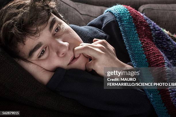 young man in blanket - frost bite stock-fotos und bilder