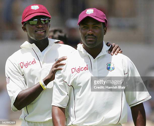 Fidel Edwards of the West Indies puts his arms around team mate Brian Lara as they leaves the field in what will likely be Lara's last Test in...