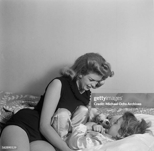 Actress Jayne Mansfield poses at home with her daughter Jayne Marie in Los Angeles,California.