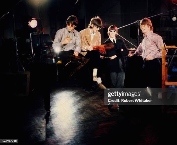 The Beatles, left to right, Paul McCartney, George Harrison, Ringo Starr and John Lennon during the Abbey Road session to record Paperback Writer and...