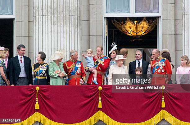 Prince George and Prince William, with other members of the royal family, spot the approaching Red Arrows display at the conclusion of the Trooping...