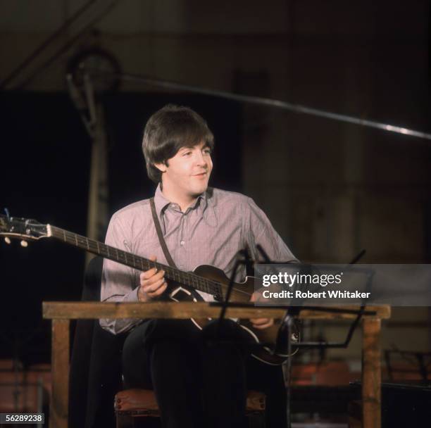 Beatles singer songwriter Paul McCartney playing the guitar during the Abbey Road session to record Paperback Writer and Rain, April 1966.