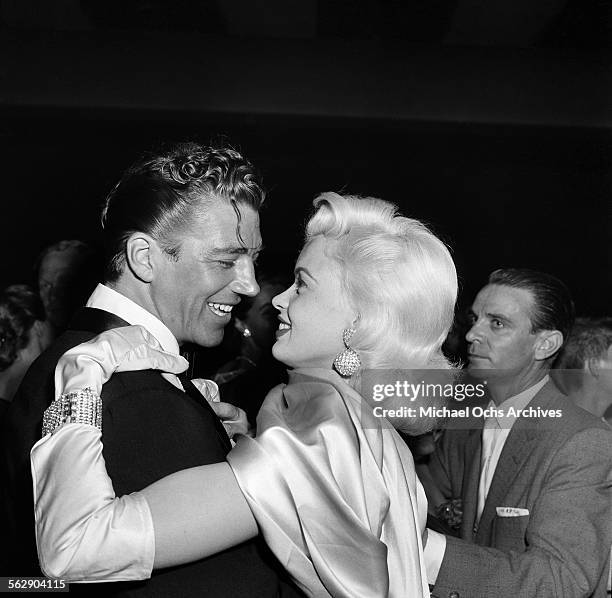 Actress Jayne Mansfield and Mickey Hargitay attend the Makeup Artist Ball in Los Angeles,California.