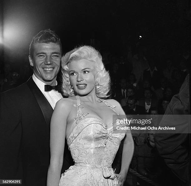 Actress Jayne Mansfield and Mickey Hargitay attend the premiere of "Giant" in Los Angeles,California.