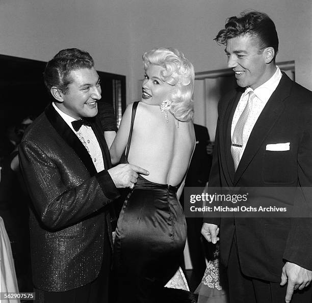 Actress Jayne Mansfield with Mickey Hargitay attend a Liberace party in Los Angeles,California.