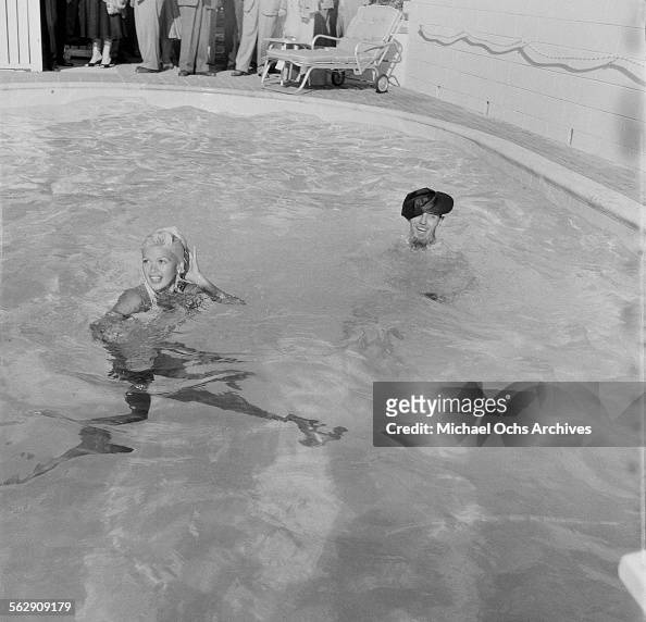 Actress Jayne Mansfield poses in a pool during a photo shoot in Los ...
