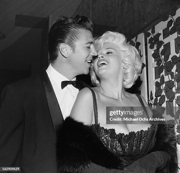 Actress Jayne Mansfield with husband Mickey Hargitay poses during the Golden Globe Awards in Los Angeles,California.