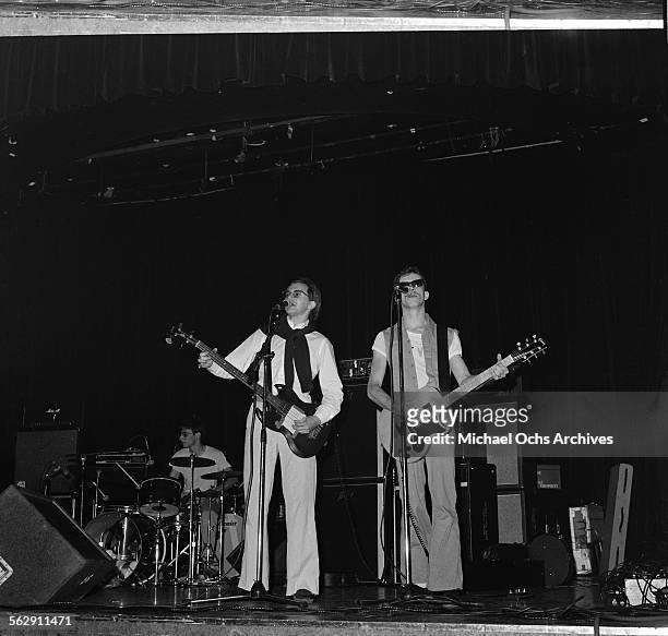 Drummer Alan Myers, bassist Gerald Casale and guitarist Bob Casale of the band "Devo" play during a Punk Fashion Show at the Stardust Ballroom in Los...