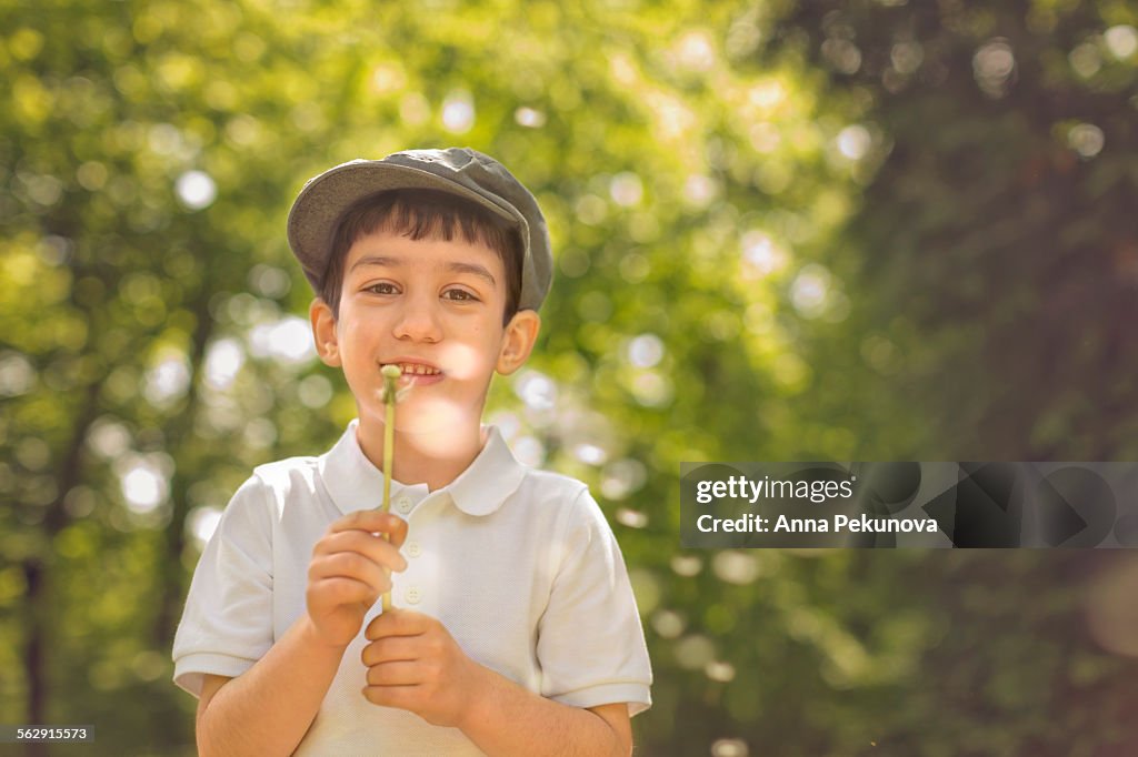 Low angle view of boy smiling at camera