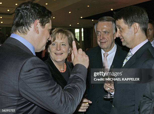 German Chancellor Angela Merkel talks to Frank Schirrmacher, publisher of the newspaper Frankfurter Allgemeine Zeitung, Germany's Minister for...