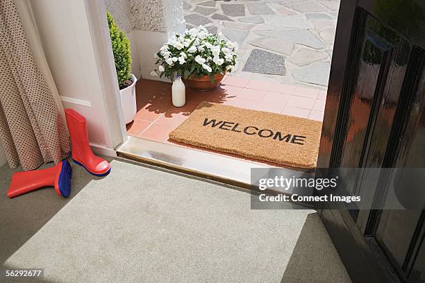 entrance to a house - doormat stock pictures, royalty-free photos & images