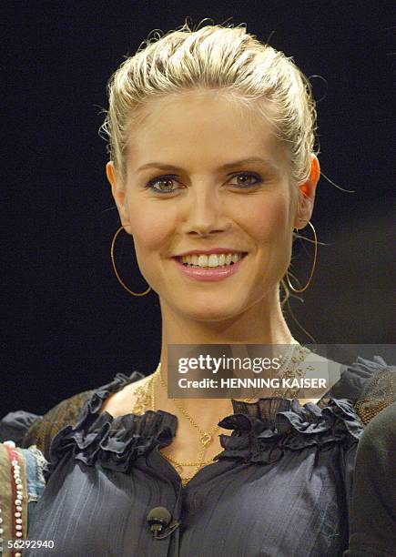 German top model Heidi Klum smiles as she visits the staff of the musical "We Will Rock You" on 29 November 2005 in Cologne, western Germany. The...