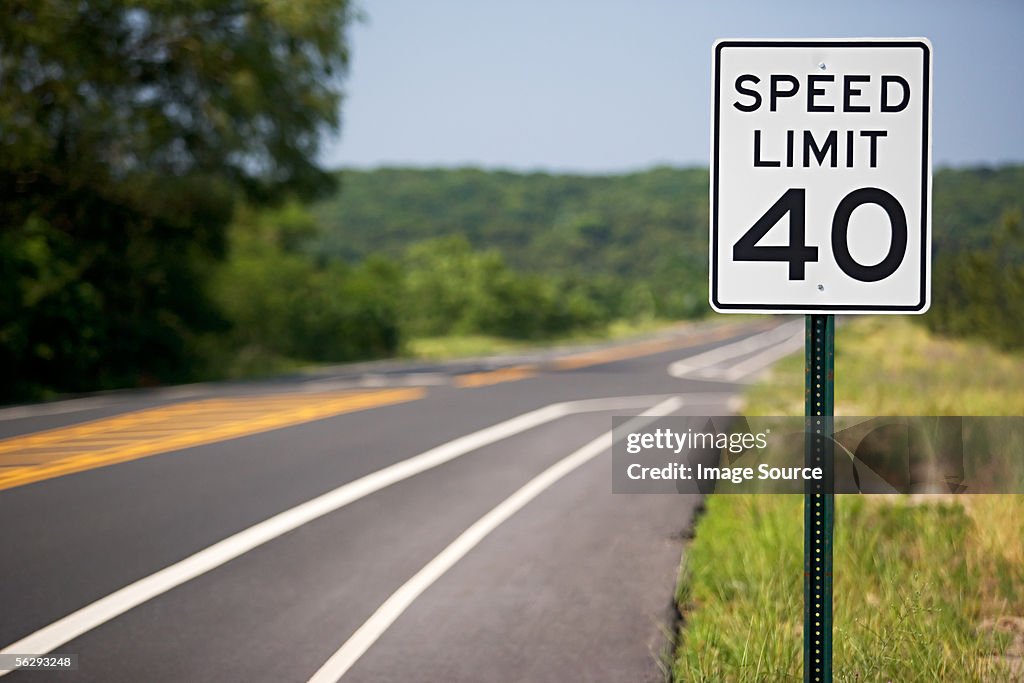 Speed limit sign by the road