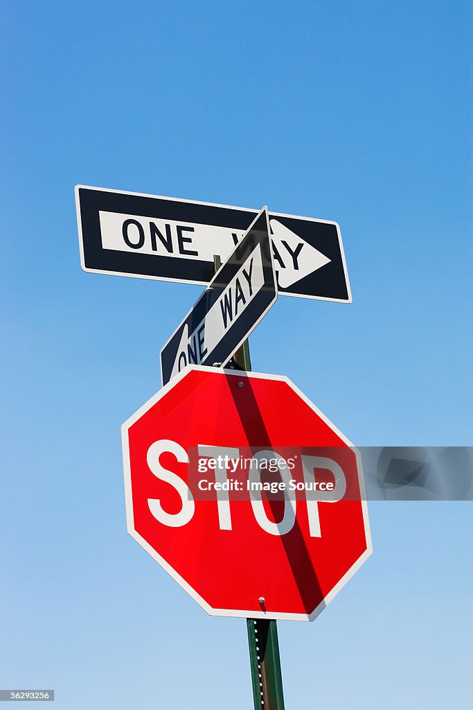 Stop sign and one way signs