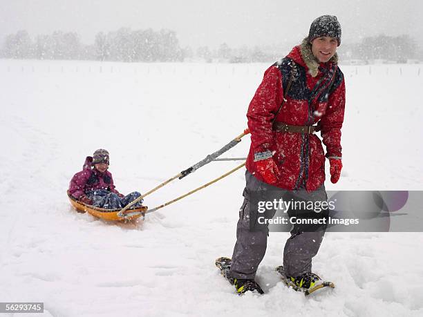 Man Riding Sled Man Pulling Sled Photos and Premium High Res Pictures - Getty Images