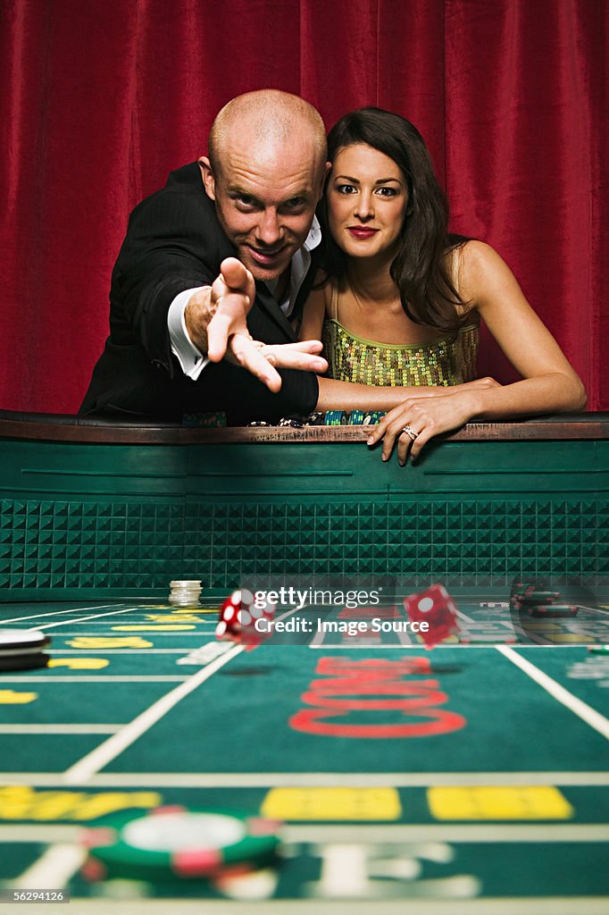 Couple playing craps