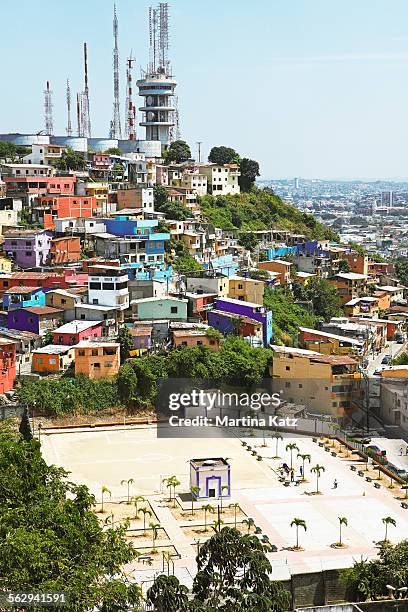 sports ground, colourful houses and radio masts on cerro del carmen, guayaquil, guayas province, ecuador - guayaquil stockfoto's en -beelden