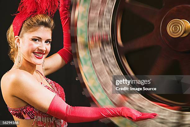 showgirl spinning the wheel of fortune - showgirl stockfoto's en -beelden