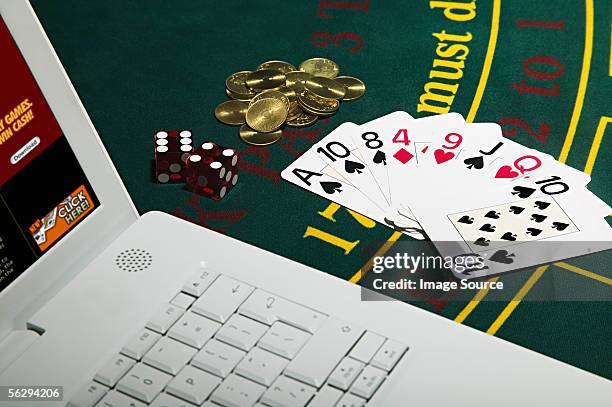 gambling with laptop computer - casino stock pictures, royalty-free photos & images