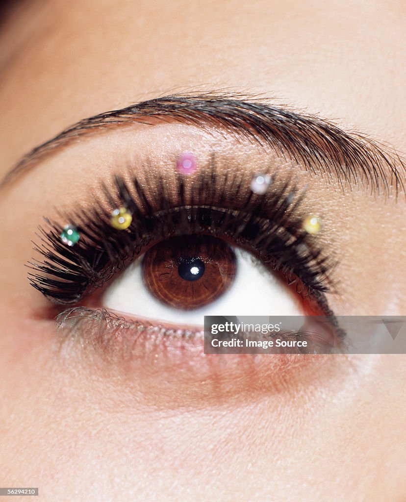 Woman with jewels on her eyelashes