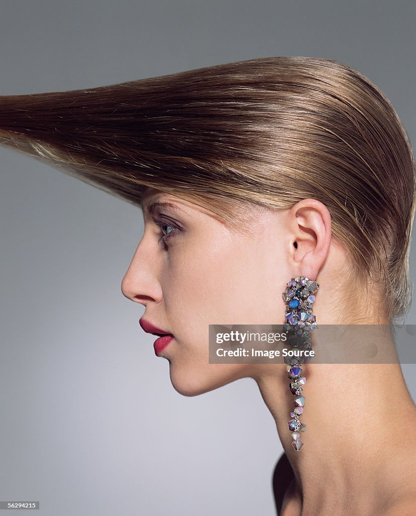 Woman with hair pulled forward