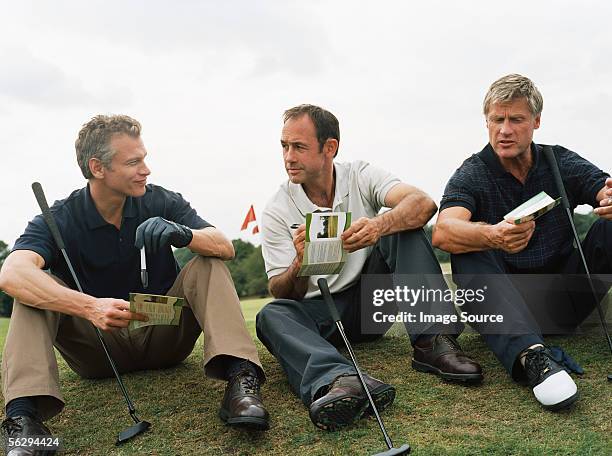 golfers discussing scores - score card stock pictures, royalty-free photos & images
