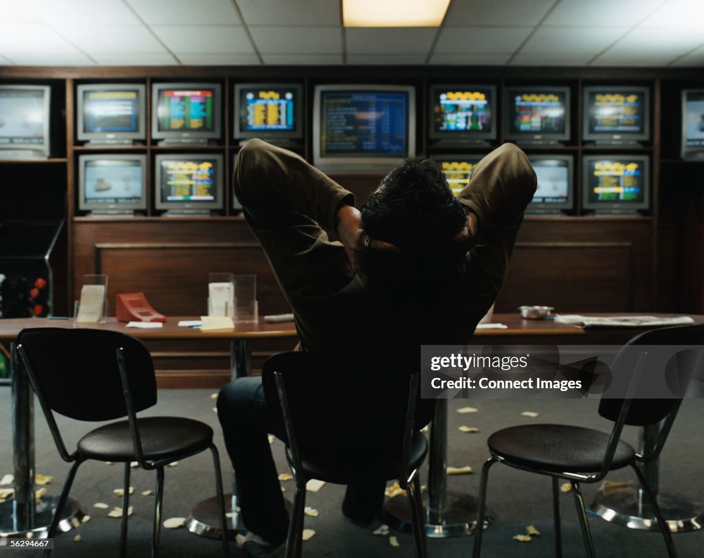 Man sitting in a betting shop
