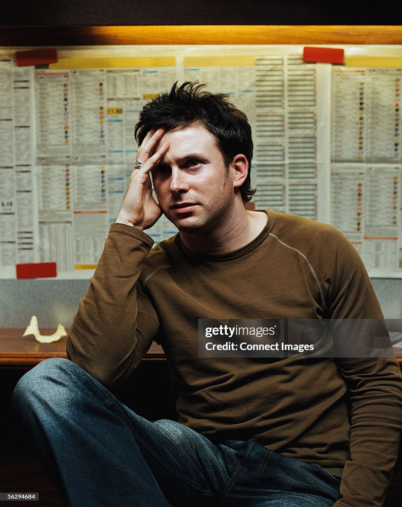 Stressed man in a betting shop