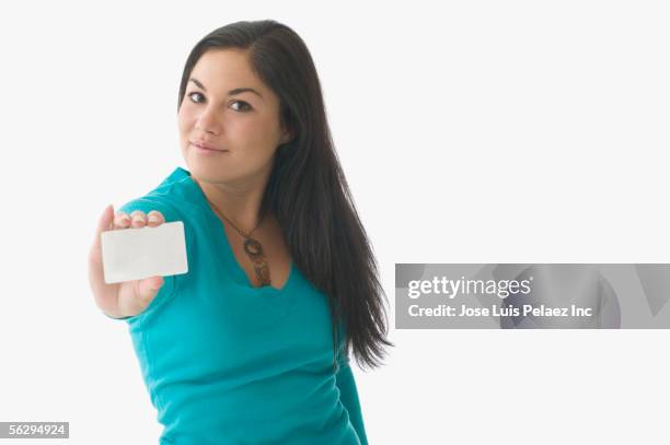 teen girl holding a credit card - skinny teen stockfoto's en -beelden