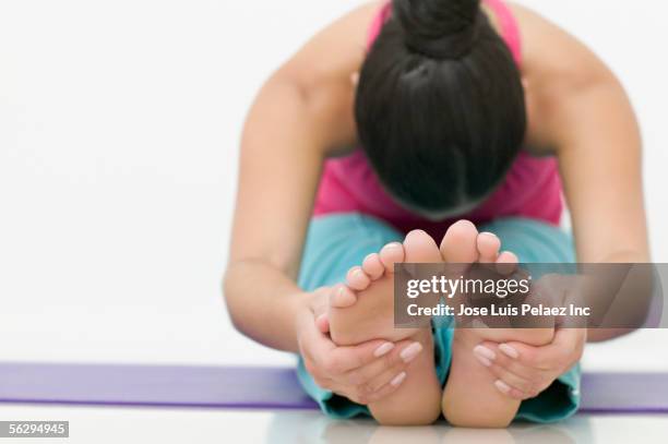 teen girl stretching for her toes - teen girls toes stock pictures, royalty-free photos & images